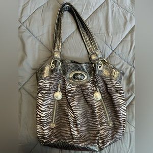 Sienna Ricchi purse. Tiger print with black, gray, white and sliver colors.